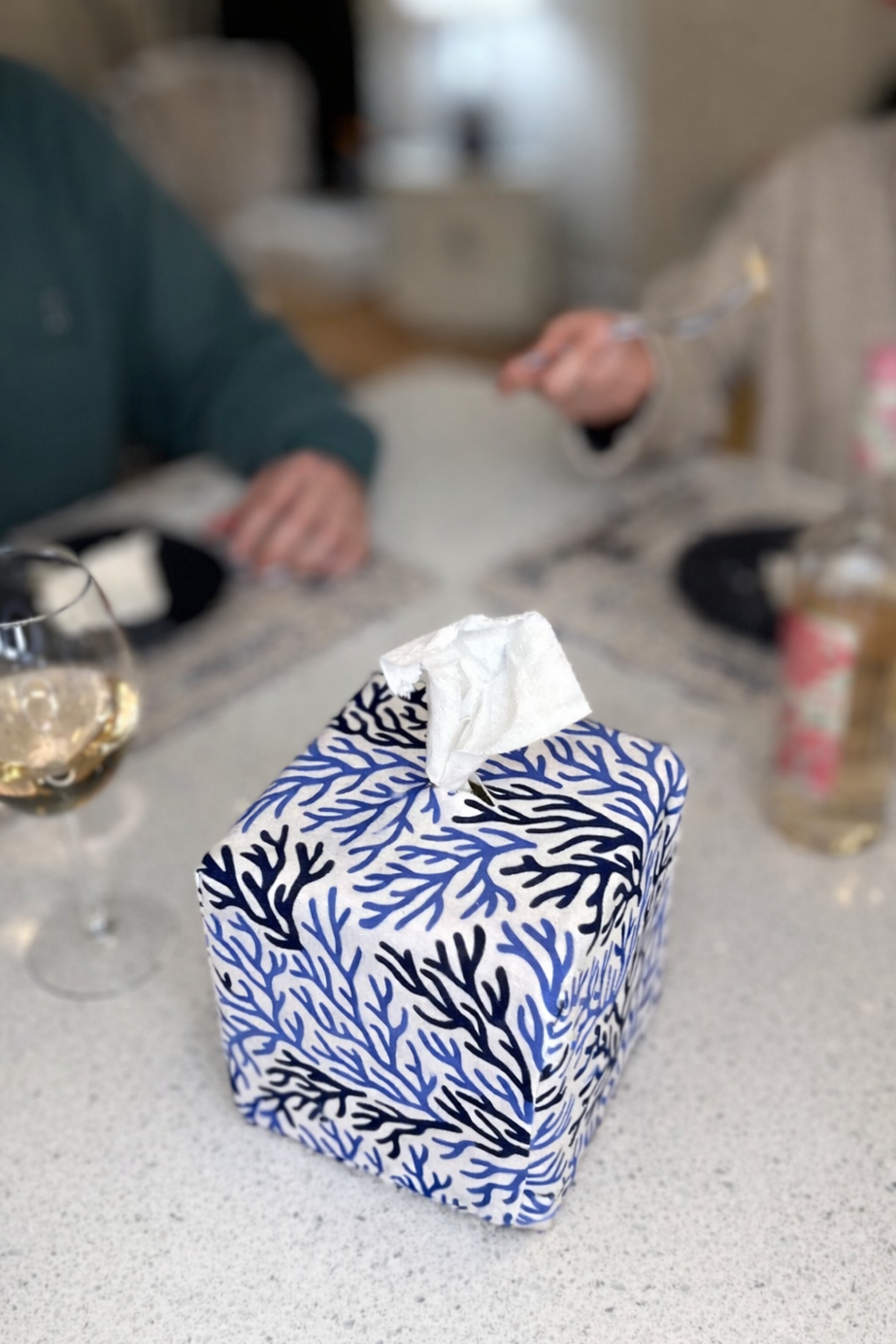 Cape Cod Coral AchooBox pattern on a table with people in the background