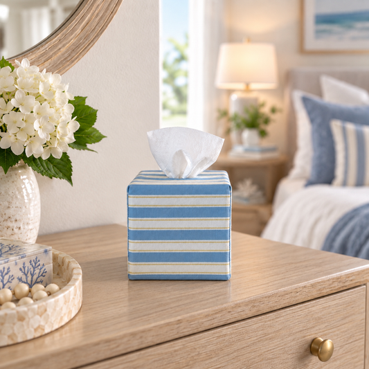 Newport Stripe AchooBox sitting on a nightstand in a blue and white bedroom. 