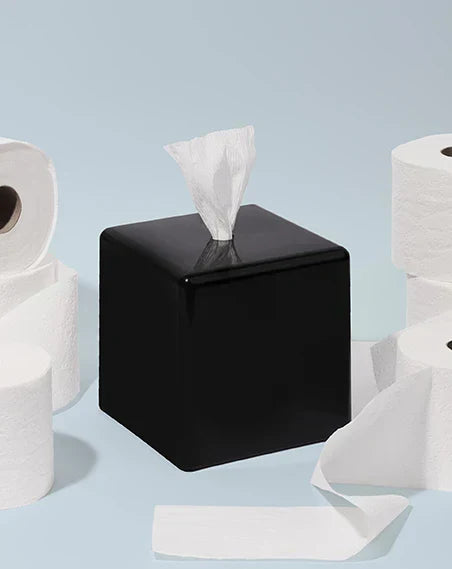 black AchooBox with rolls of tissue