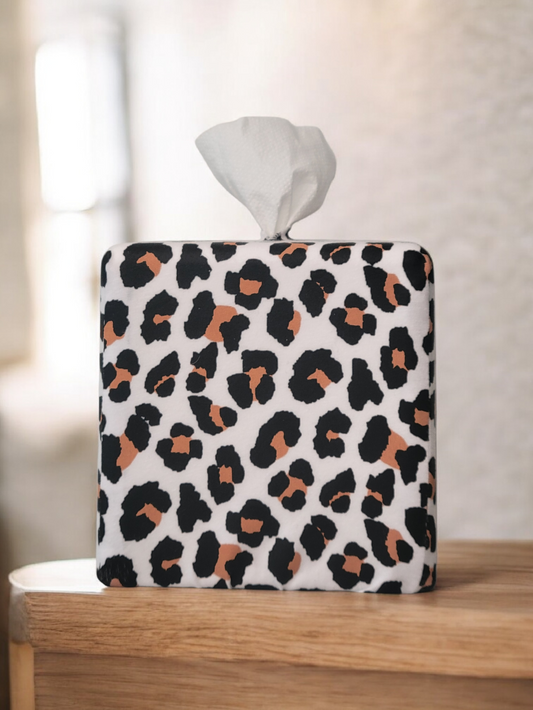 AchooBox Rolled Tissue Dispenser with Modern Leopard AchooCover on wooden table.