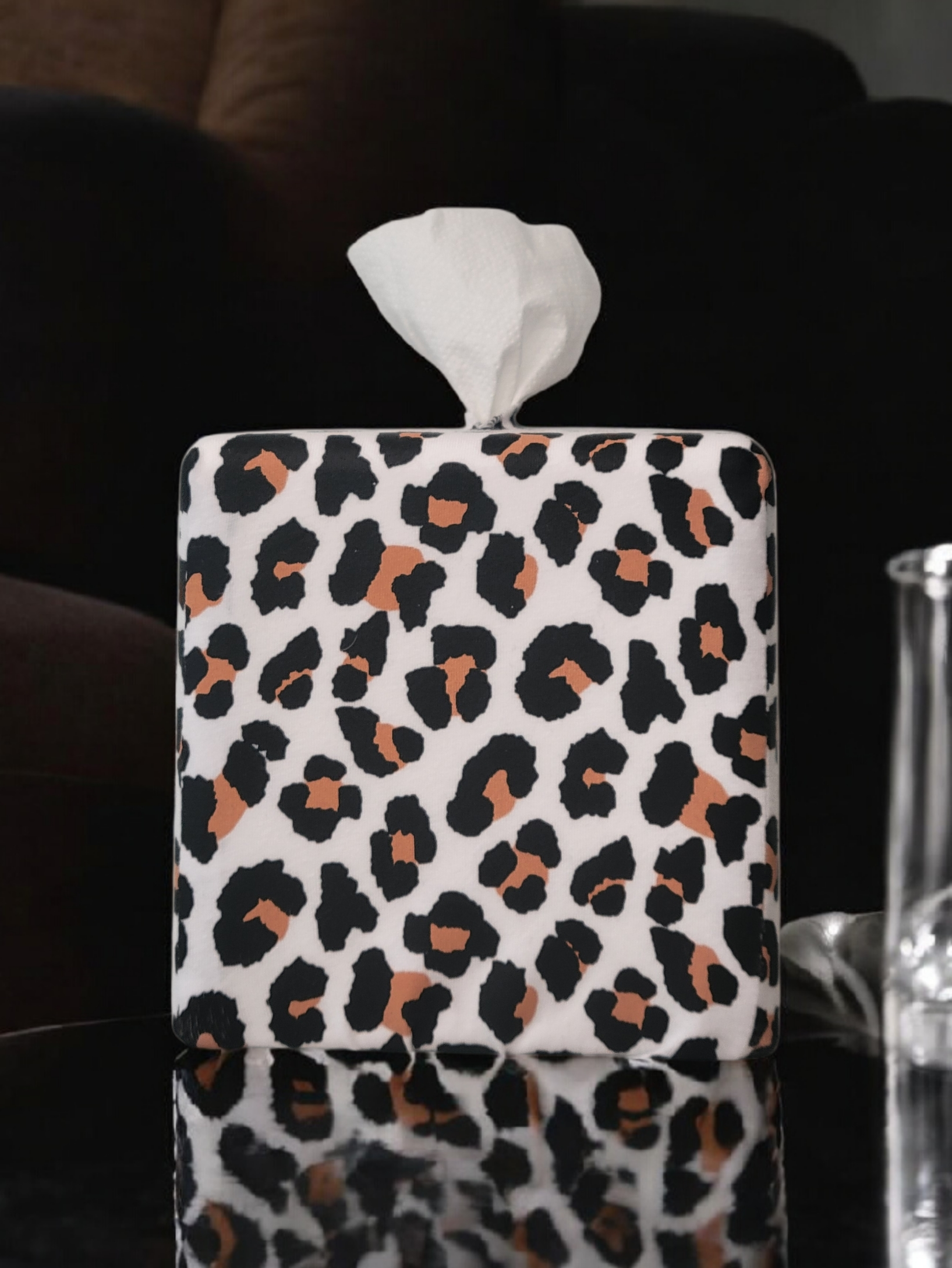 Modern Leopard AchooBox on glass table with dark background