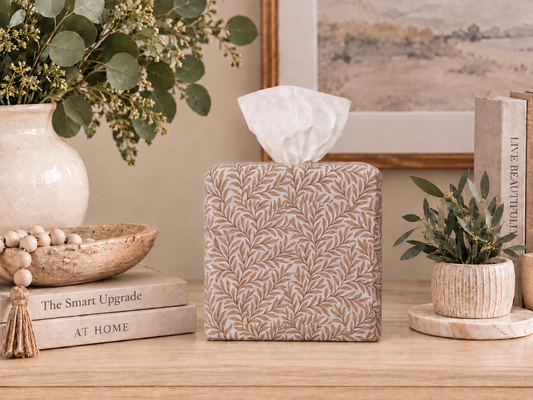 Natural Linen Leaf on a console table with books, plants and picture in background. 